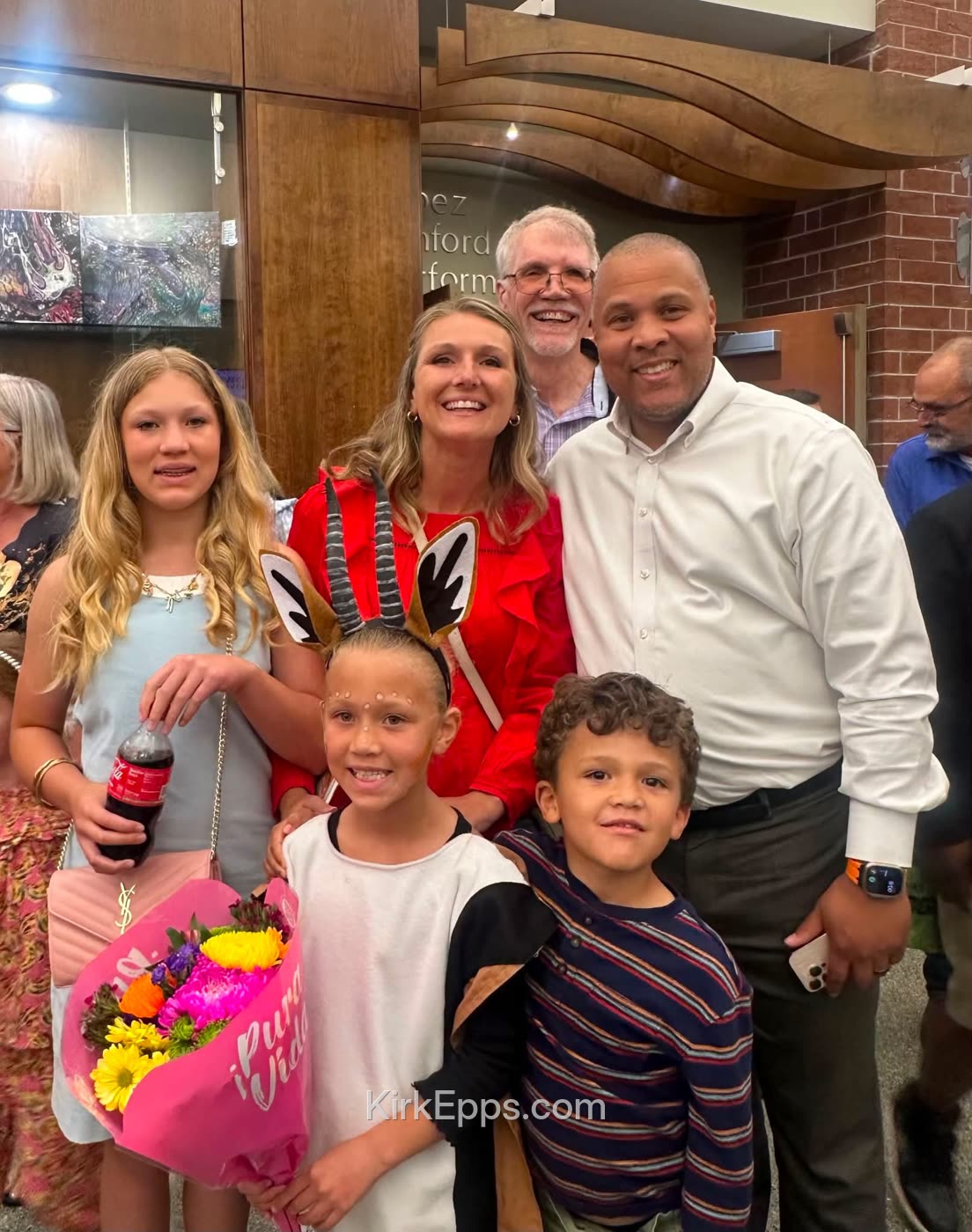 Kirk, his wife and their kids celebrating after a performance